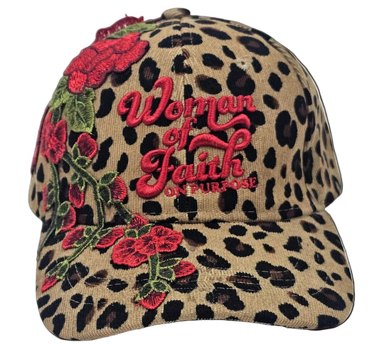Leopard print hat with floral designs and 'Woman Of Faith On Purpose' branding on a white background