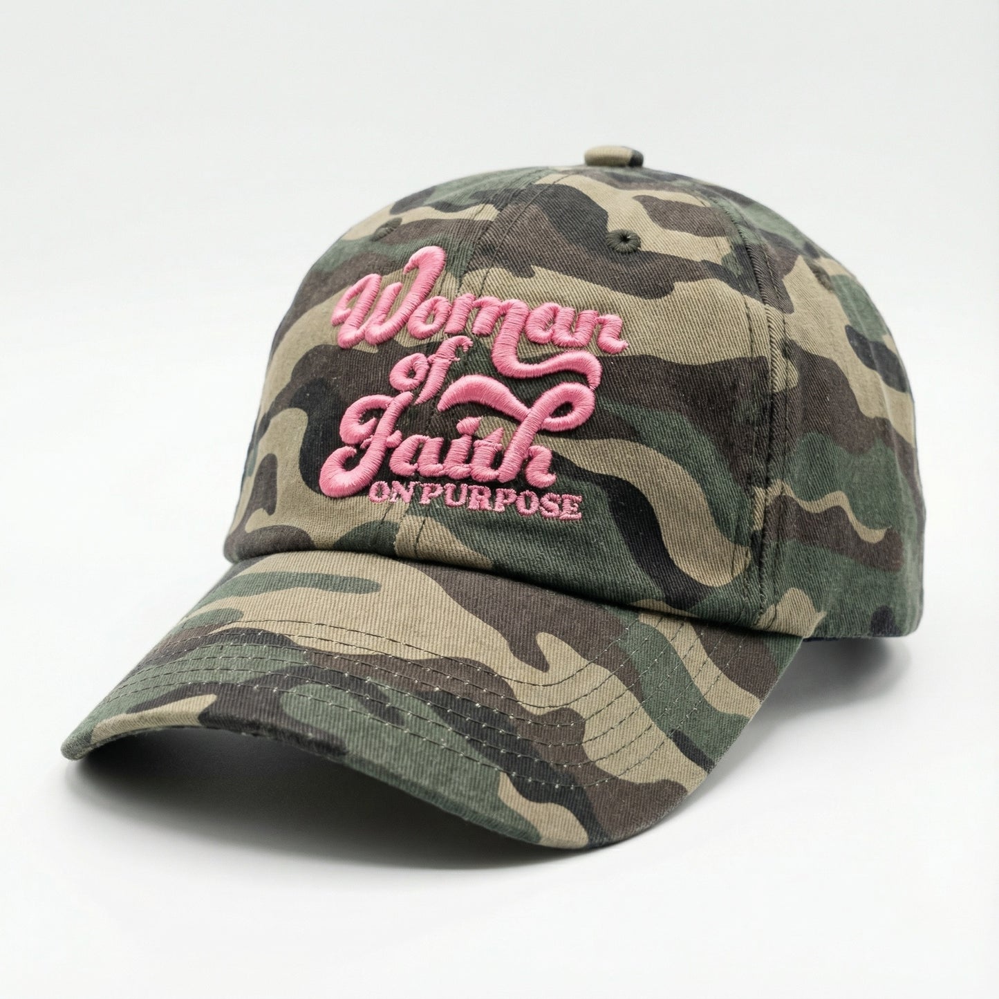 Pink and grey camo hat with bold 'Woman of Faith On Purpose' embroidery, a sturdy daily uniform for intentional living.