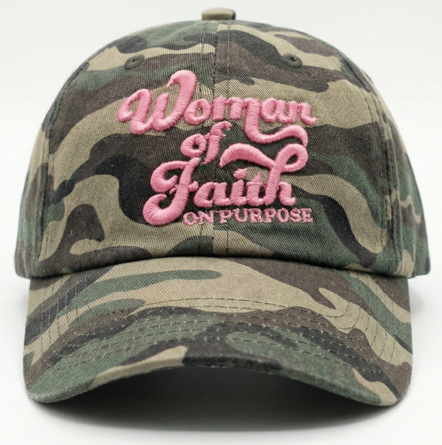 Pink and grey camo hat with bold 'Woman of Faith On Purpose' embroidery, a sturdy daily uniform for intentional living.