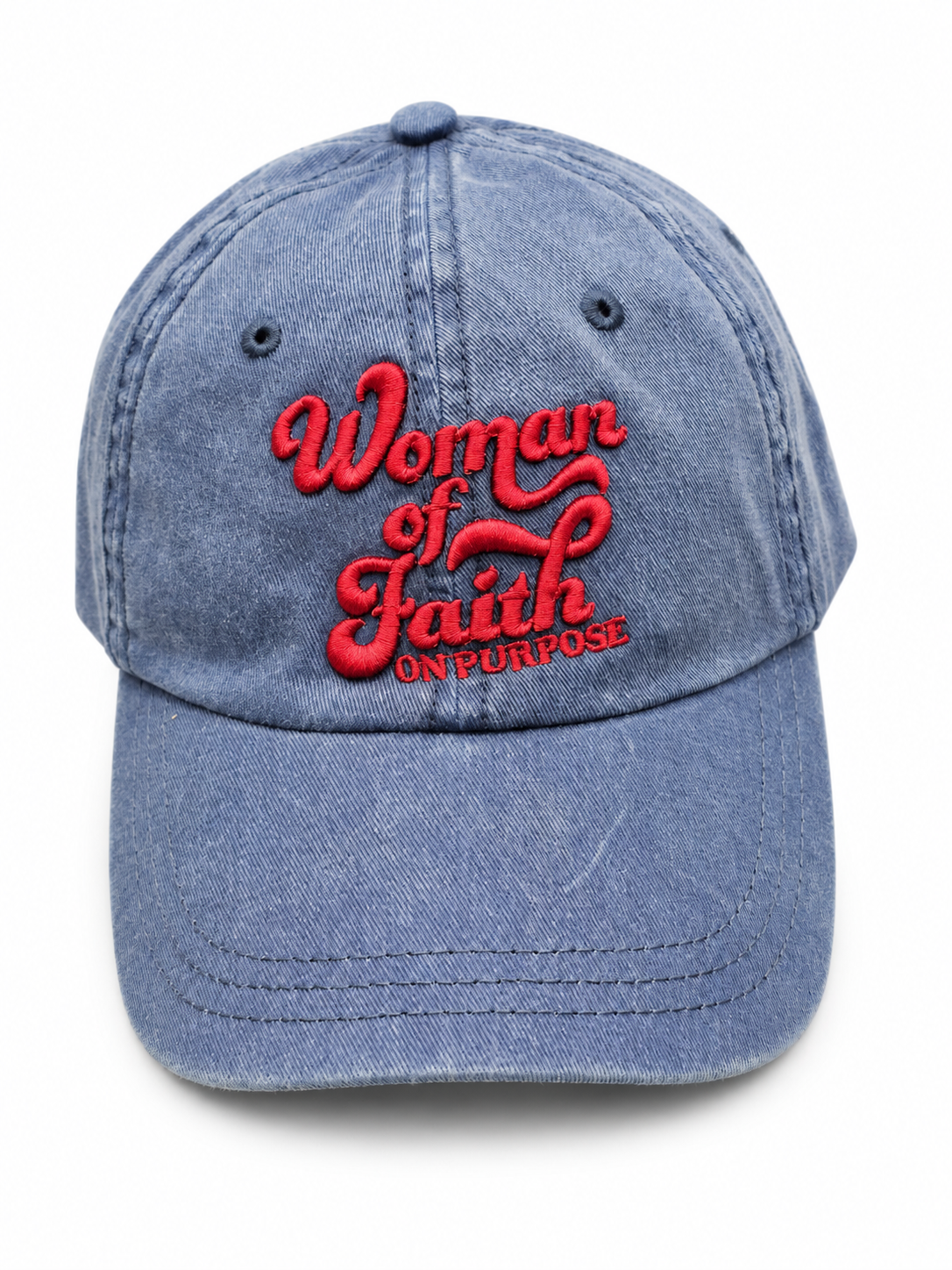 A blue denim baseball cap featuring red embroidered text on the front that reads 'Woman of Faith ON PURPOSE' against a plain white background.