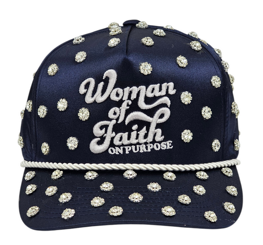 Navy blue cap with white embellishments and 'Woman of Faith On Purpose' text on a white background