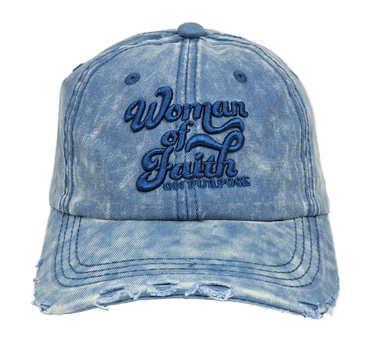 Front view of the Woman Of Faith On Purpose™ Vintage Denim Hat featuring a light blue washed denim finish, distressed curved brim, raised tonal blue embroidery, adjustable fit, and casual vintage styling.